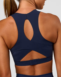 Woman wearing Fusion Sports Bra 2.0 - Future Navy | Model:Charlie | Size:S