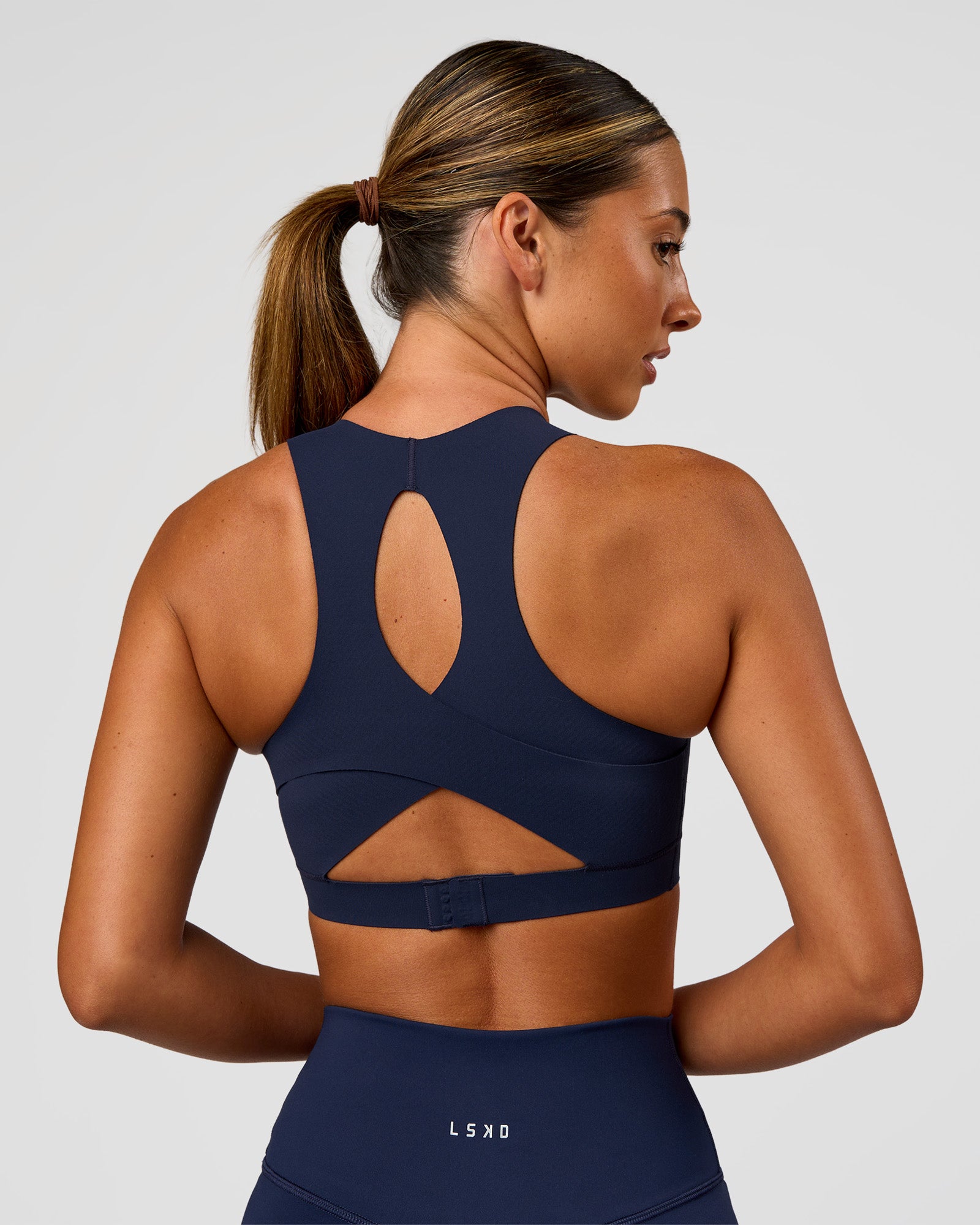 Woman wearing Fusion Sports Bra 2.0 - Future Navy | Model:Charlie | Size:S