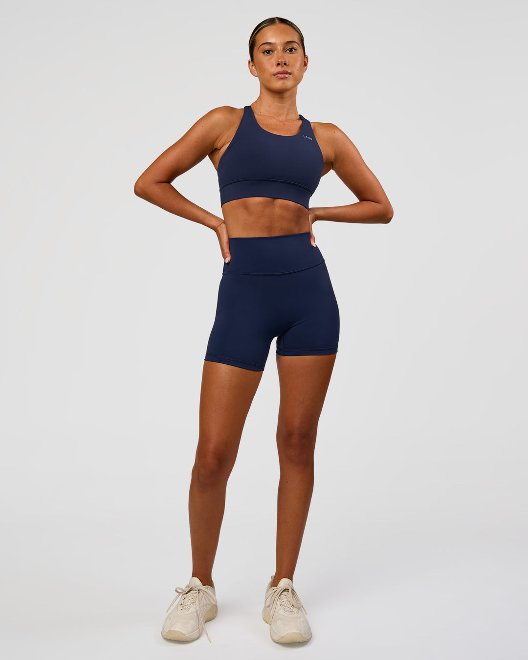 Woman wearing Fusion Ultra High-Rise 4" Short - Future Navy | Model:Charli | Size:XS