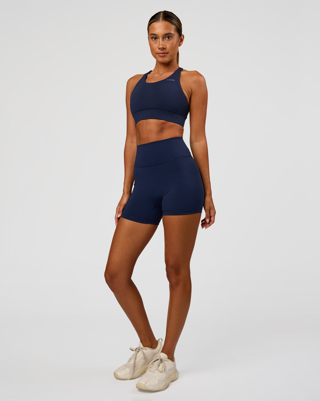 Woman wearing Fusion Ultra High-Rise 4" Short - Future Navy | Model:Charli | Size:XS