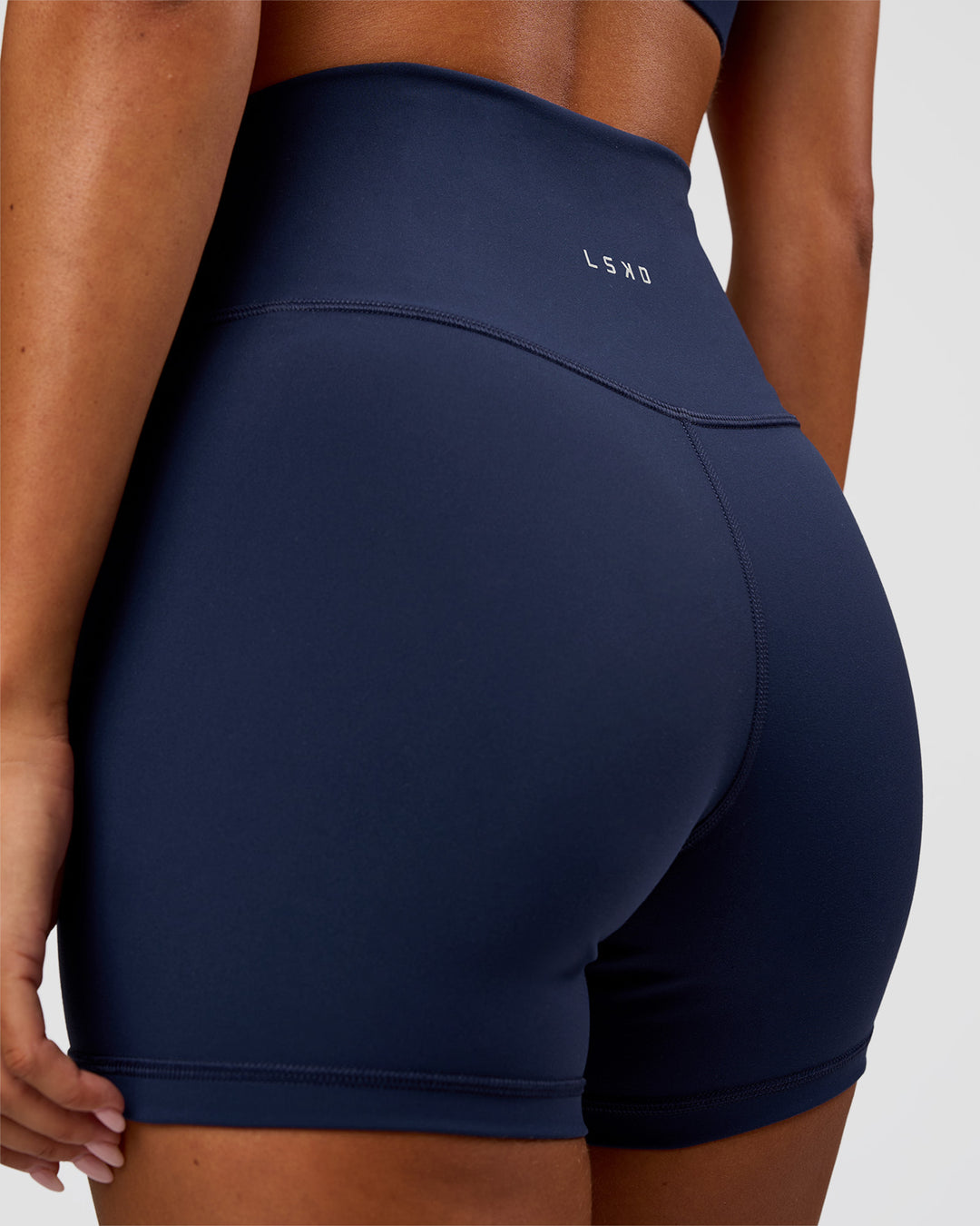 Woman wearing Fusion Ultra High-Rise 4" Short - Future Navy | Model:Charli | Size:XS
