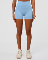 Woman wearing Fusion Ultra High-Rise 4" Short Pockets - Open Air | Set:true | Angle:front | Model:Charli | Size:XS