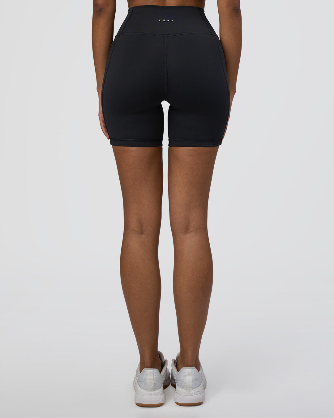 Woman wearing Fusion Ultra High-Rise 6&quot; Short Pockets - Black | Model:Jordan | Size:S