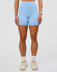 Woman wearing Fusion Ultra High-Rise 6" Short Pockets - Open Air | Set:true | Angle:front | Model:Maja | Size:XS