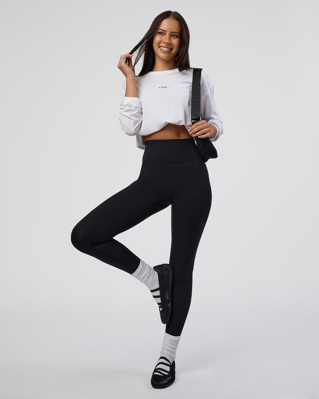 Woman wearing Fusion Ultra High-Rise Full Length Legging - Black | Model:Eliza | Size:XS