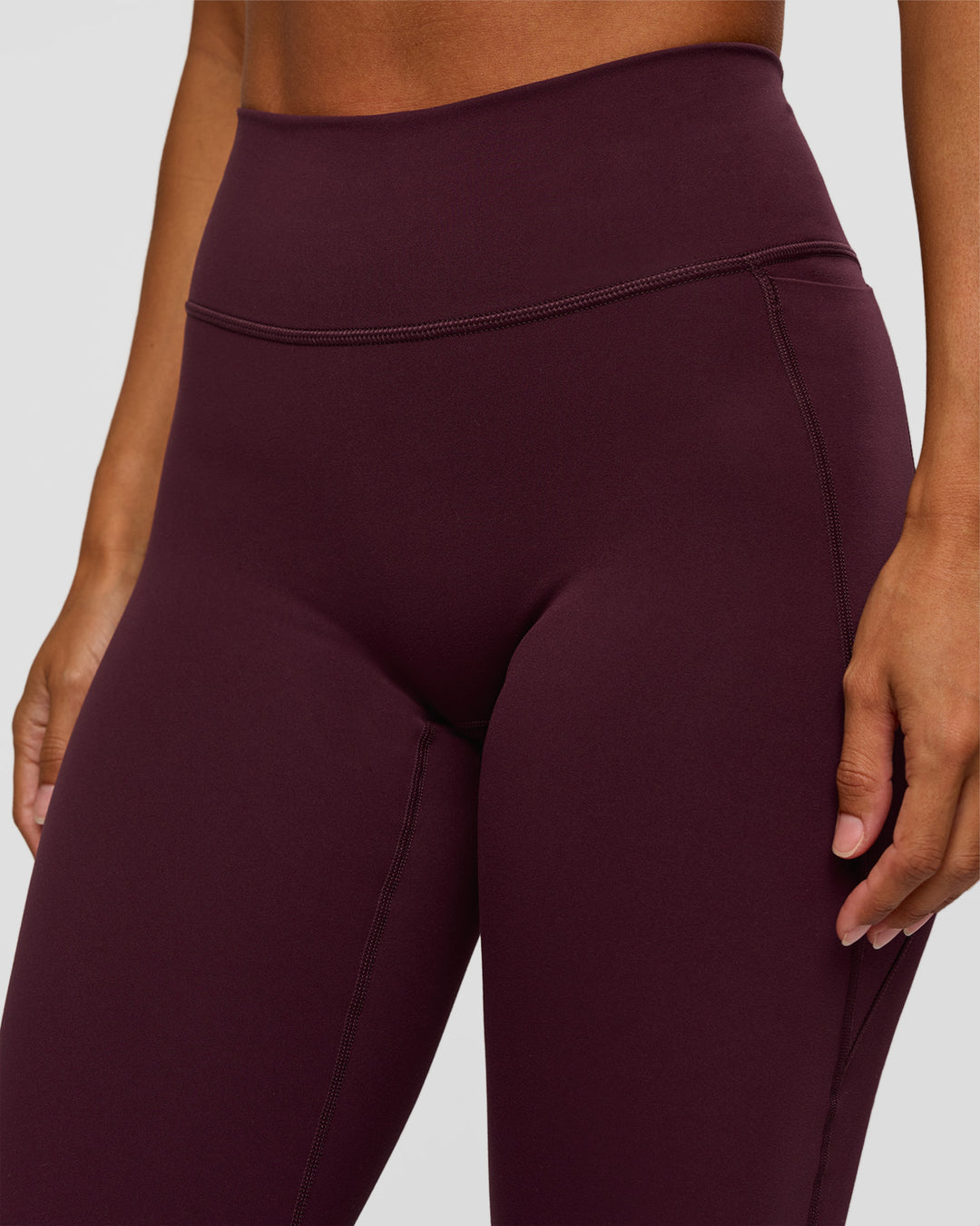 Woman wearing Fusion V-Contour High-Rise Flared Petite Legging Pockets - Cherry Lacquer | Model:Brylee | Size:XS