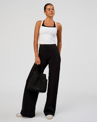 Woman wearing Fusion V-Contour High-Rise Pant - Black | Model:Charli | Size:XS
