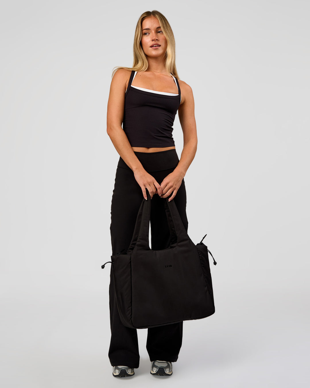 Woman wearing Fusion V-Contour High-Rise Petite Pant - Black | Model:Issy | Size:XS