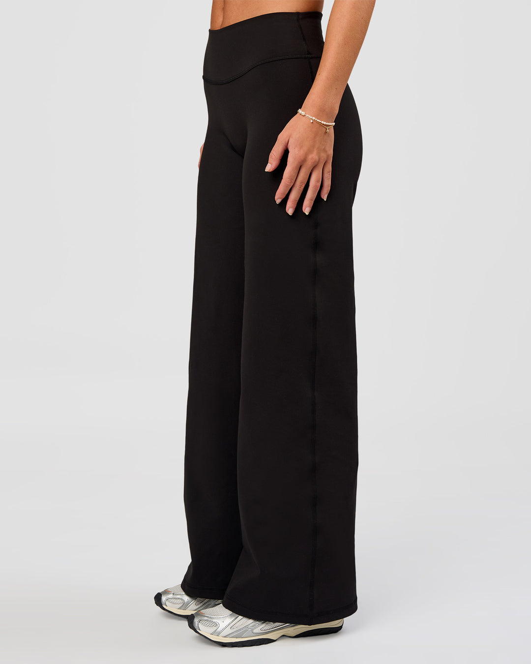 Woman wearing Fusion V-Contour High-Rise Petite Pant - Black | Model:Issy | Size:XS