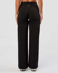 Woman wearing Fusion V-Contour High-Rise Petite Pant - Black | Model:Issy | Size:XS