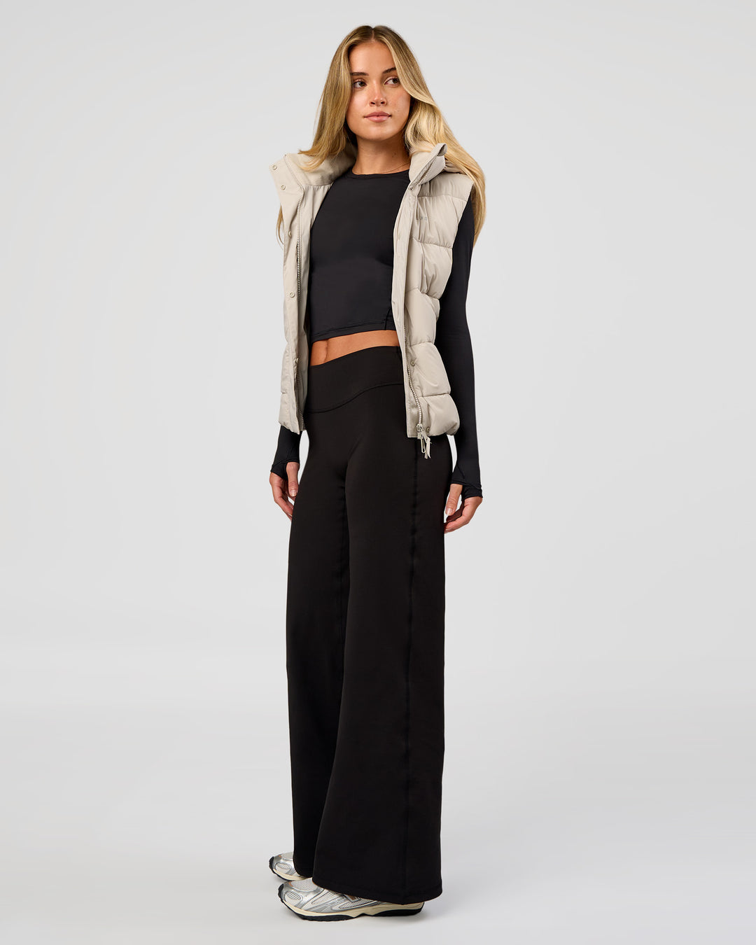 Woman wearing Fusion V-Contour High-Rise Petite Pant - Black | Model:Issy | Size:XS
