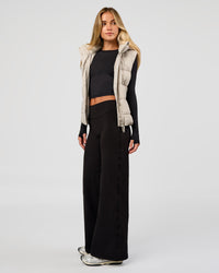 Woman wearing Fusion V-Contour High-Rise Petite Pant - Black | Model:Issy | Size:XS