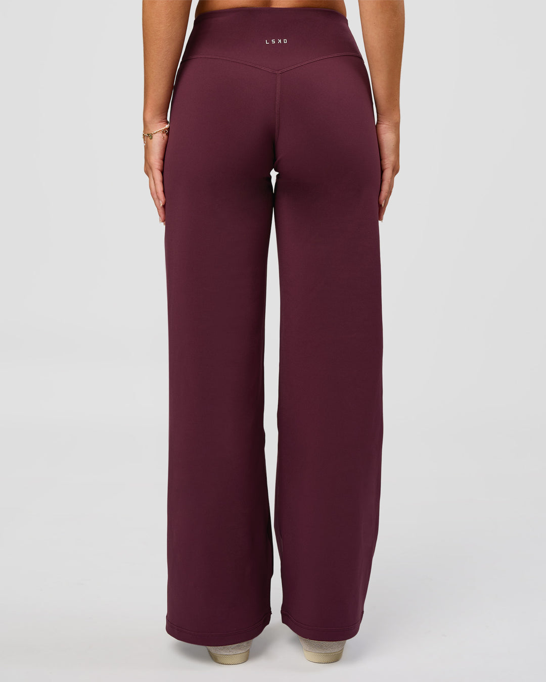Woman wearing Fusion V-Contour High-Rise Petite Pant - Cherry Lacquer | Model:Issy | Size:XS