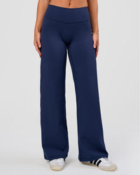 Model wearing Fusion V-Contour High-Rise Petite Pant - Future Navy | Model:Issy | Size:XS