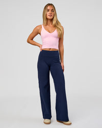 Model wearing Fusion V-Contour High-Rise Petite Pant - Future Navy | Model:Issy | Size:XS