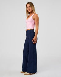 Model wearing Fusion V-Contour High-Rise Petite Pant - Future Navy | Model:Issy | Size:XS
