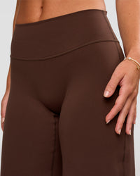 Model wearing Fusion V-Contour High-Rise Petite Pant - Hot Chocolate | Model:Issy | Size:XS