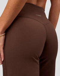 Model wearing Fusion V-Contour High-Rise Petite Pant - Hot Chocolate | Model:Issy | Size:XS