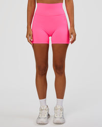 Woman wearing Fusion V-Contour Ultra High-Rise 4” Short Pockets - Sugar Plum | Model:Brylee | Size:XS