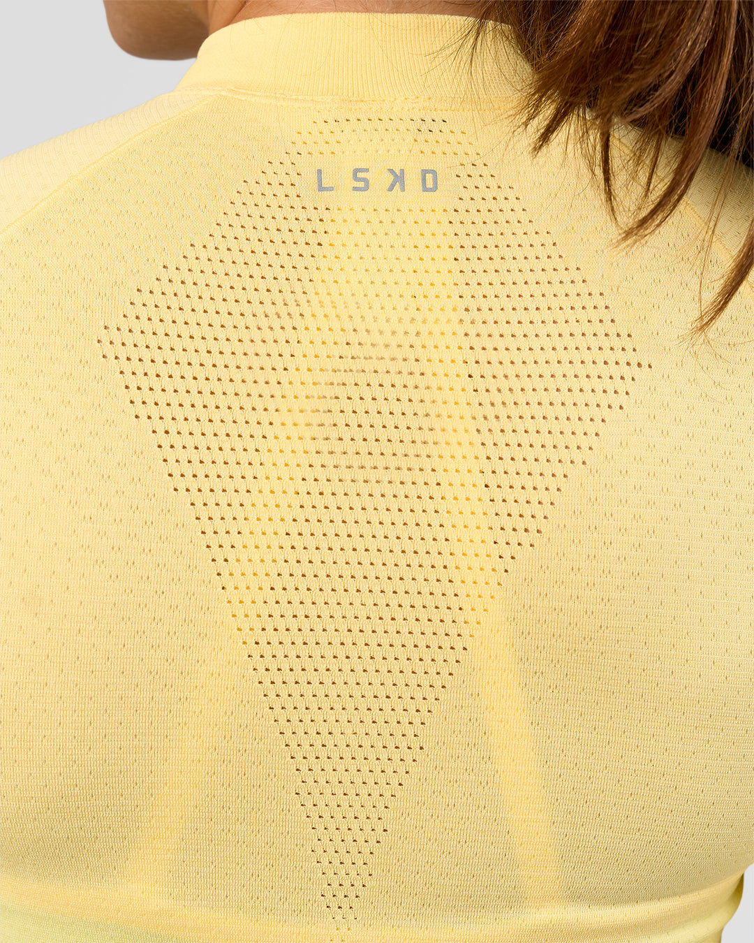 Woman wearing GG AeroFLX+ Long Sleeve Half Zip - Lemon-Baltic Sea | Model:Grace | Size:XS
