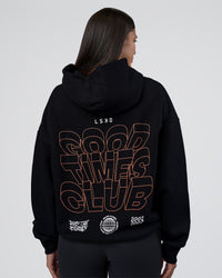 Woman wearing GTC CVC Fleece Unisex Oversized Hoodie - Black-Cantaloupe | Model:Rhiley | Size:XS