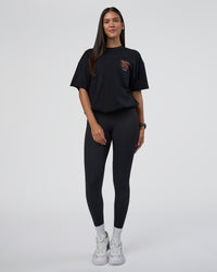 Woman wearing GTC Heavyweight Oversized Tee - Black-Cantaloupe | Model:Rhiley | Size:XS