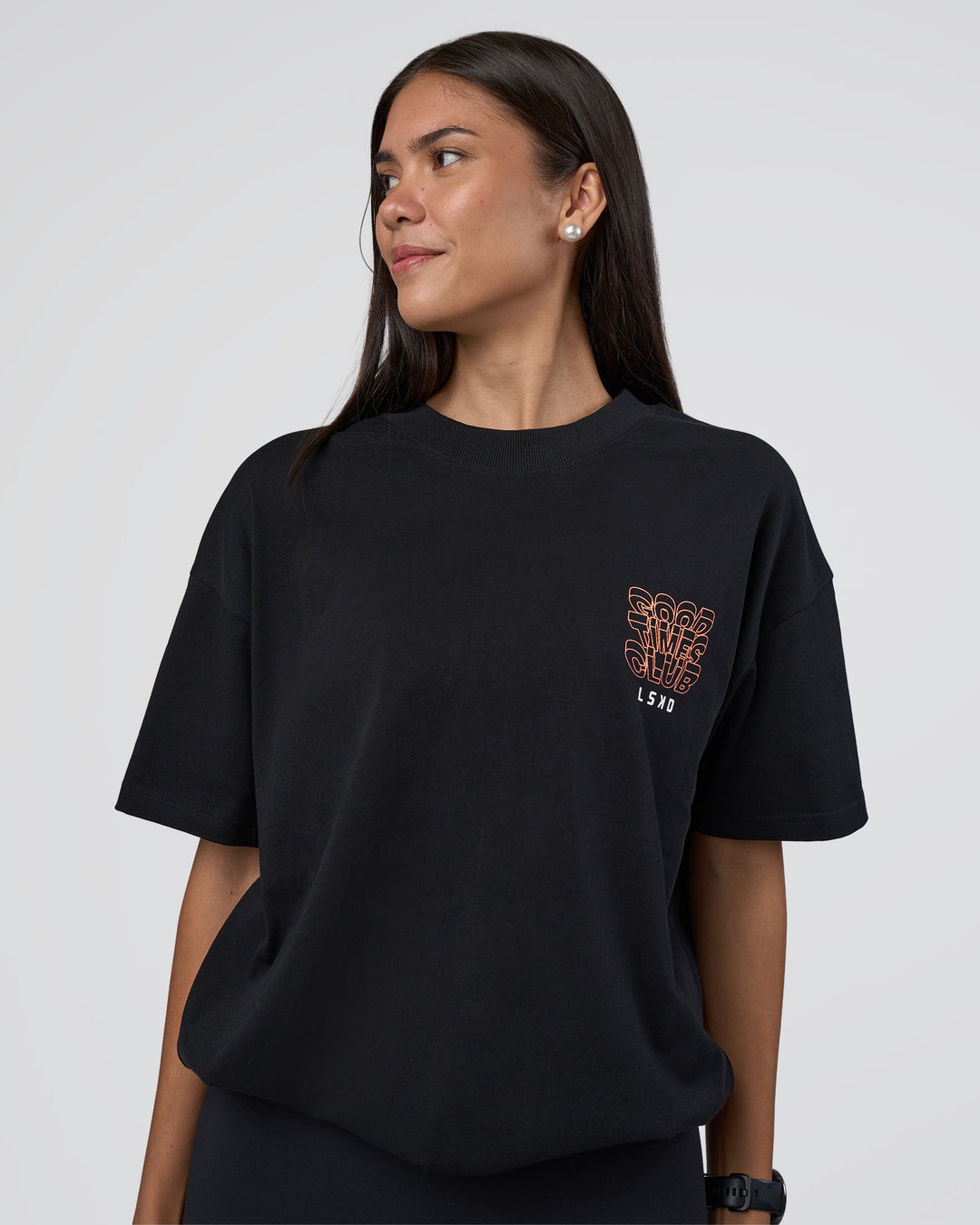 Woman wearing GTC Heavyweight Oversized Tee - Black-Cantaloupe | Model:Rhiley | Size:XS