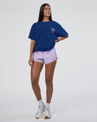 Woman wearing GTC Heavyweight Oversized Tee - Washed Midnight Blue-Marsh | Model:Rhiley | Size:XS