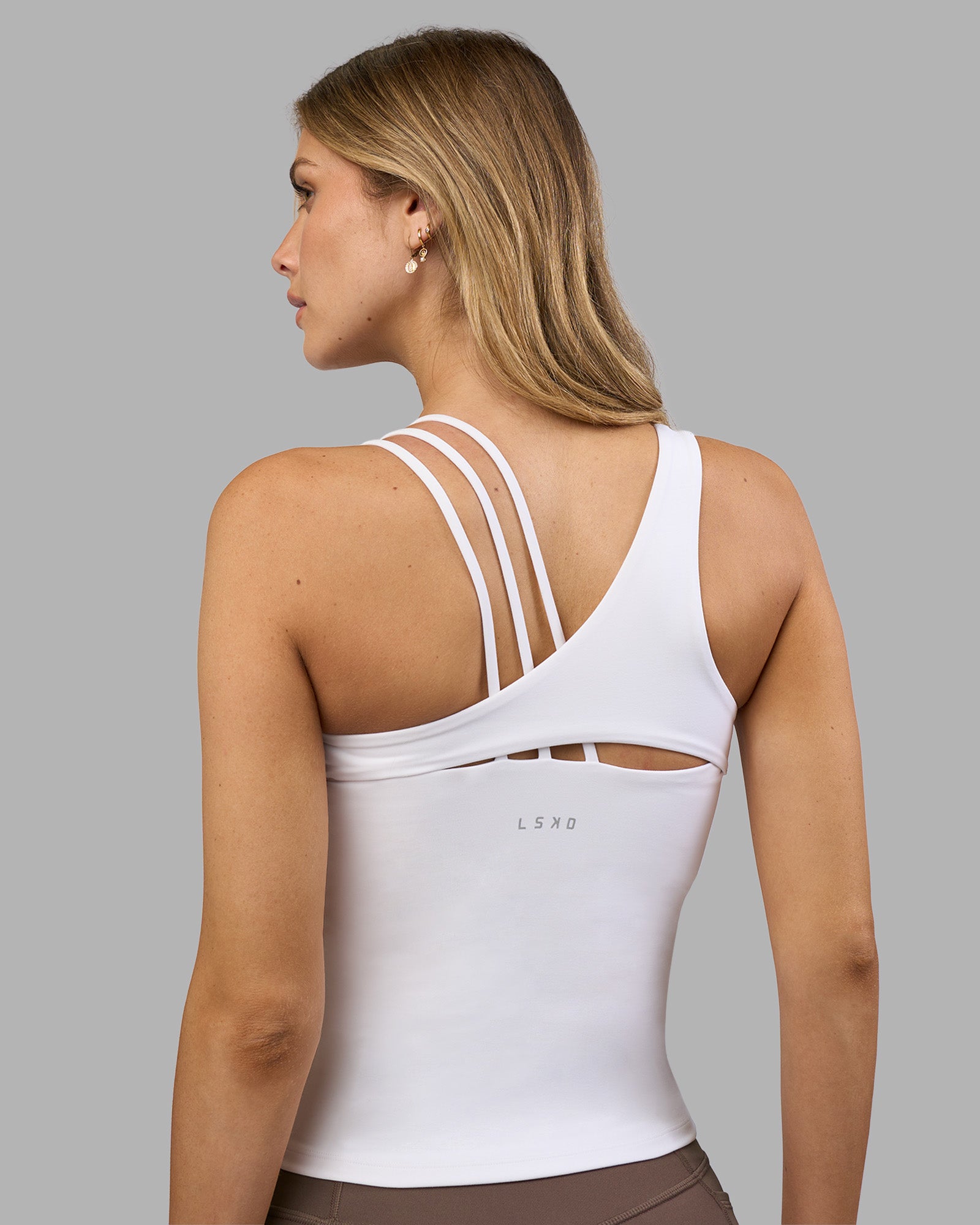 Woman wearing Galvanise Splice Shelf Bra Tank - White | Model:Leilani | Size:XS