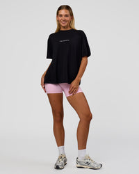 Woman wearing Go-To 1% Better Every Day FLXCotton Oversized Tee - Black-White | Model:Amity | Size:XS