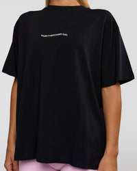 Woman wearing Go-To 1% Better Every Day FLXCotton Oversized Tee - Black-White | Model:Amity | Size:XS