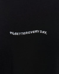 Woman wearing Go-To 1% Better Every Day FLXCotton Oversized Tee - Black-White | Model:Amity | Size:XS