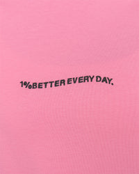 Woman wearing Go-To 1% Better Every Day FLXCotton Oversized Tee - Candy Pink-Black | Model:Amity | Size:XS