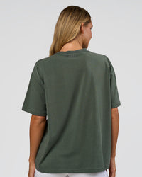 Woman wearing Go-To 1% Better Every Day FLXCotton Oversized Tee - Carbon Green Washed-White | Model:Amity | Size:XS