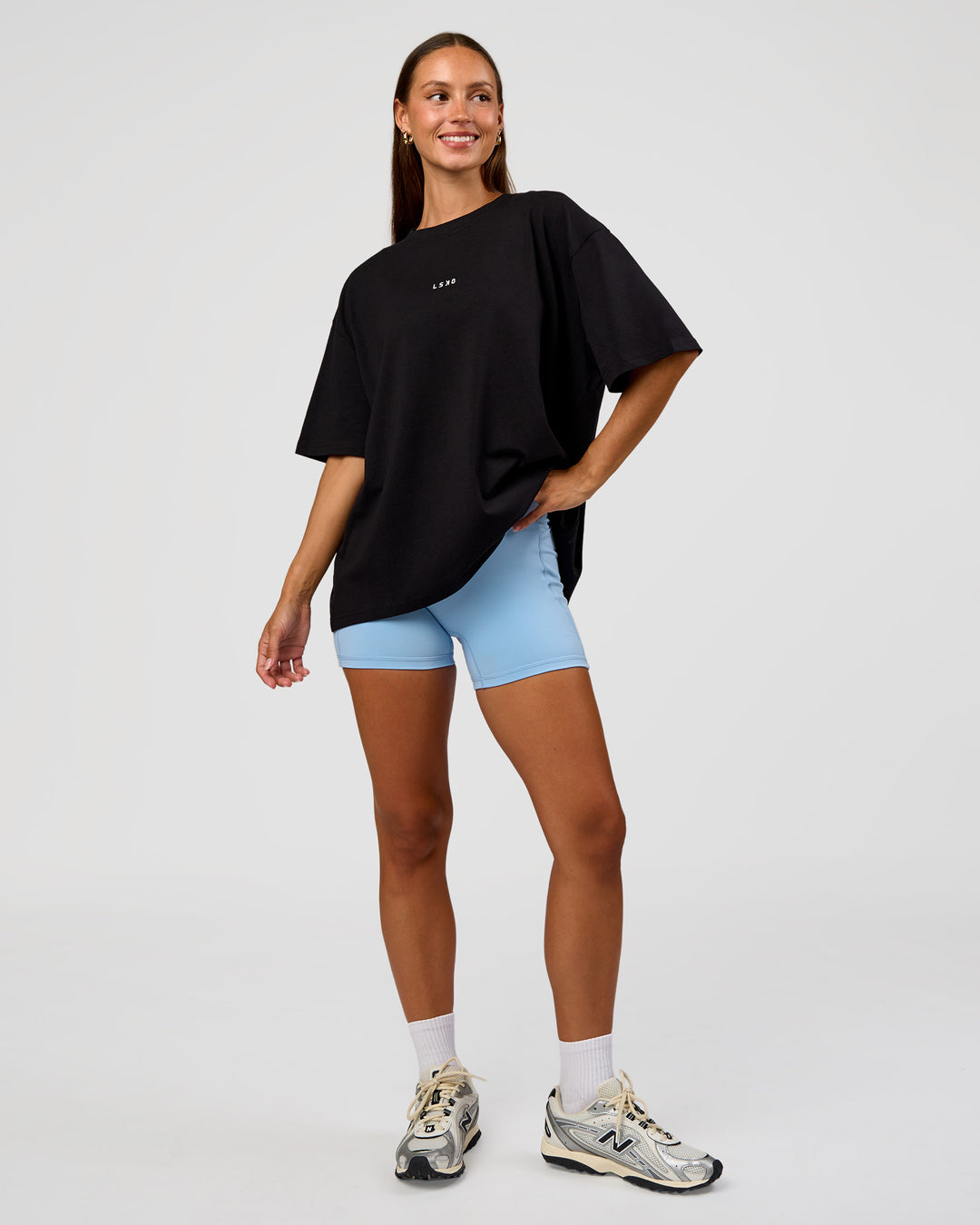Woman wearing Go-To Break Through FLXCotton Oversized Tee - Black-Open Air | Model:Brylee | Size:XS