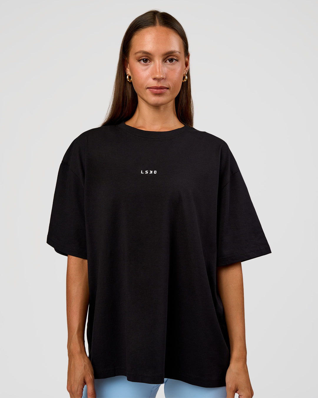 Woman wearing Go-To Break Through FLXCotton Oversized Tee - Black-Open Air | Model:Brylee | Size:XS