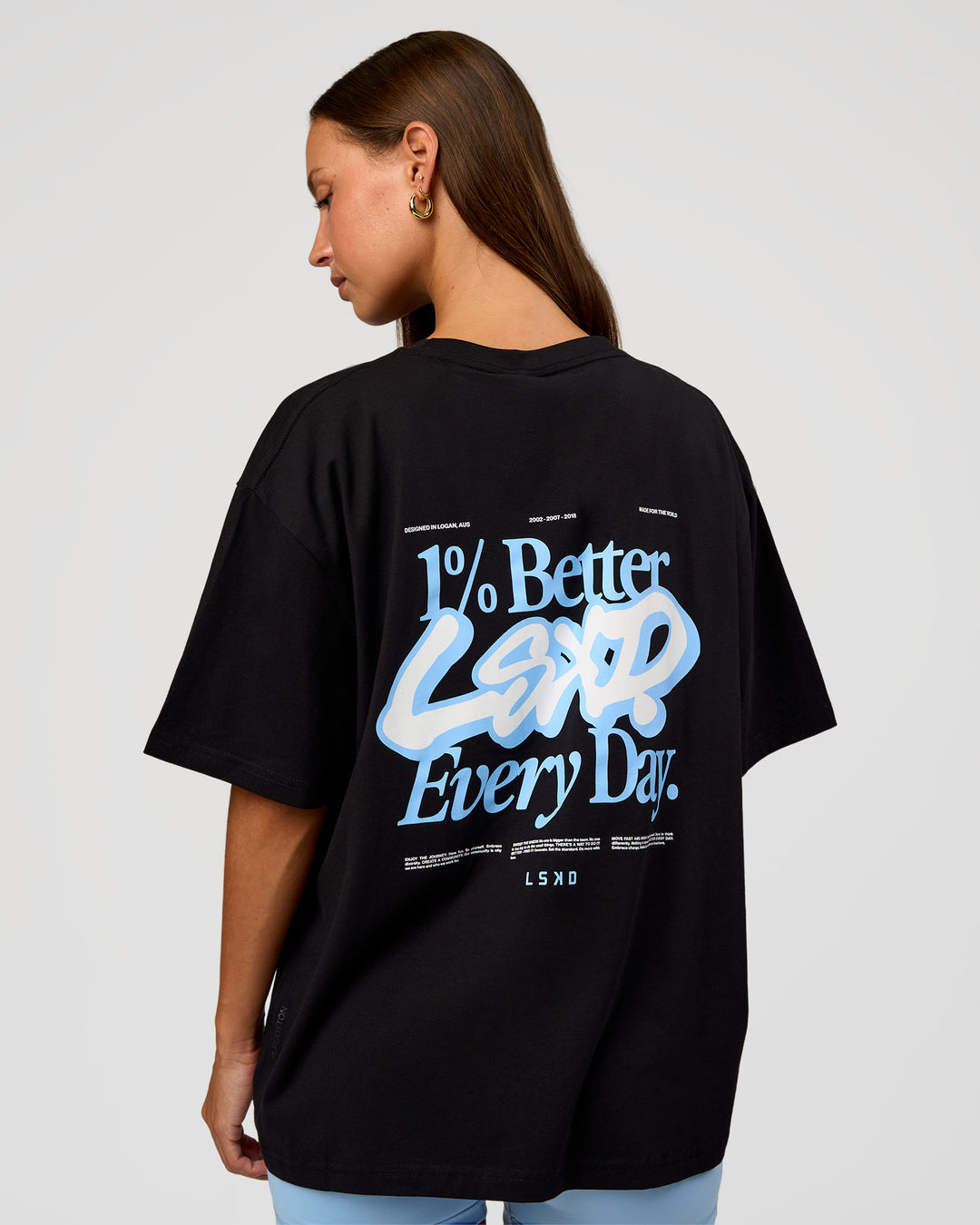 Woman wearing Go-To Break Through FLXCotton Oversized Tee - Black-Open Air | Model:Brylee | Size:XS