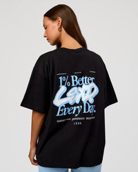 Woman wearing Go-To Break Through FLXCotton Oversized Tee - Black-Open Air | Model:Brylee | Size:XS