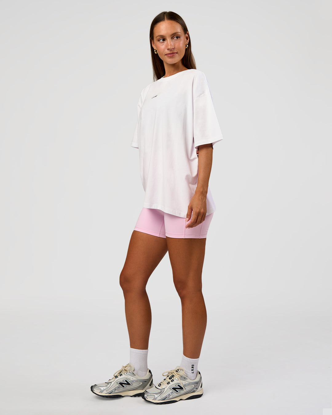 Woman wearing Go-To Break Through FLXCotton Oversized Tee - White-Marshmallow | Model:Brylee | Size:XS