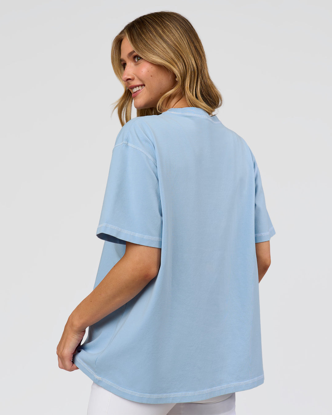 Woman wearing Go-To Contrast Oversized Heavyweight FLXCotton Tee - Open Air Washed-White | Model:Leilani | Size:XS