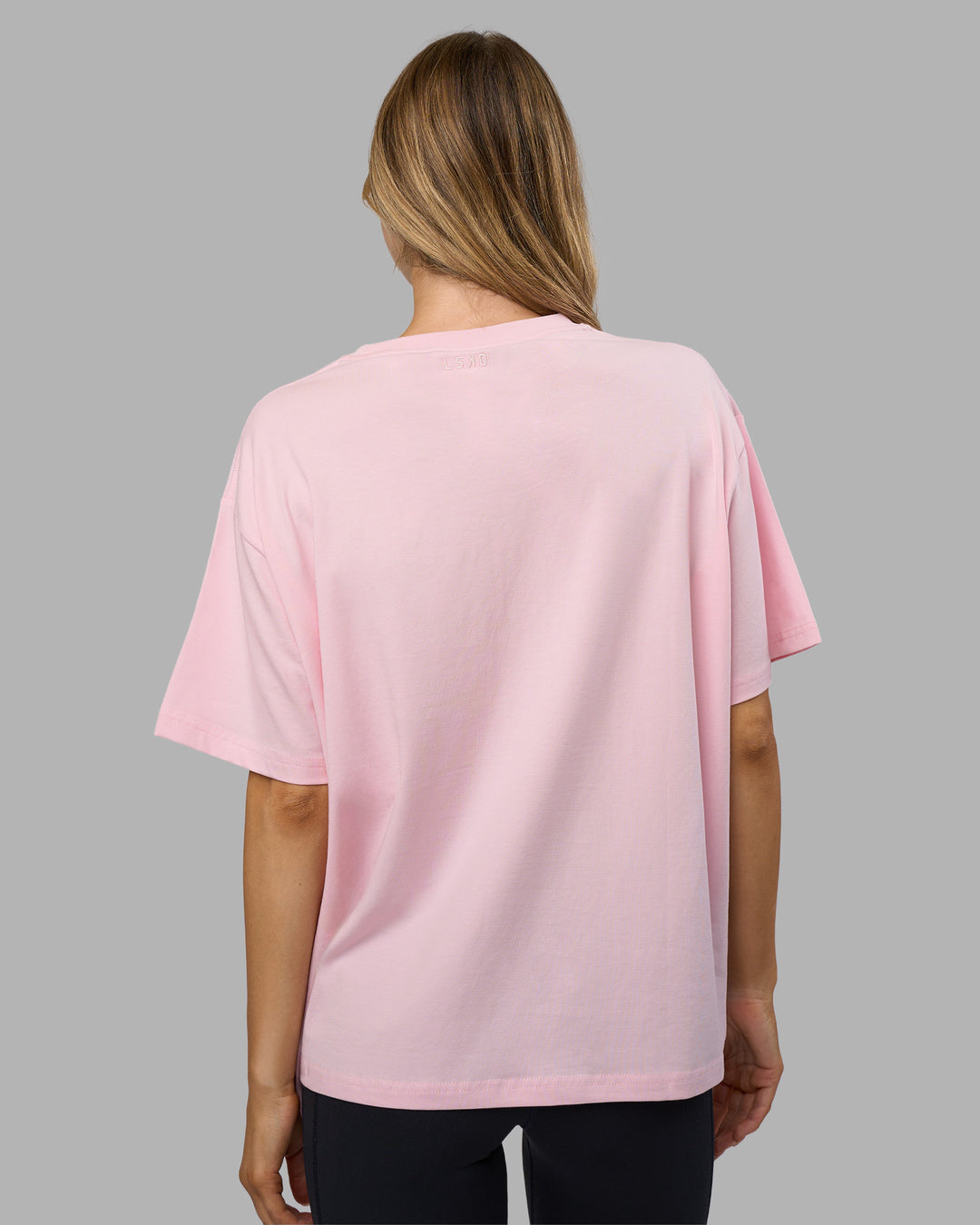 Woman wearing Go-To E.T.J FLXCotton Oversized Tee - Marshmallow-Plum Caspia | Model:Leilani | Size:XS