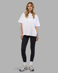 Woman wearing Go-To E.T.J FLXCotton Oversized Tee - White-Black | Model:Leilani | Size:XS