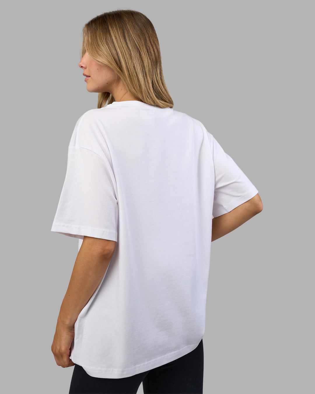 Woman wearing Go-To E.T.J FLXCotton Oversized Tee - White-Black | Model:Leilani | Size:XS