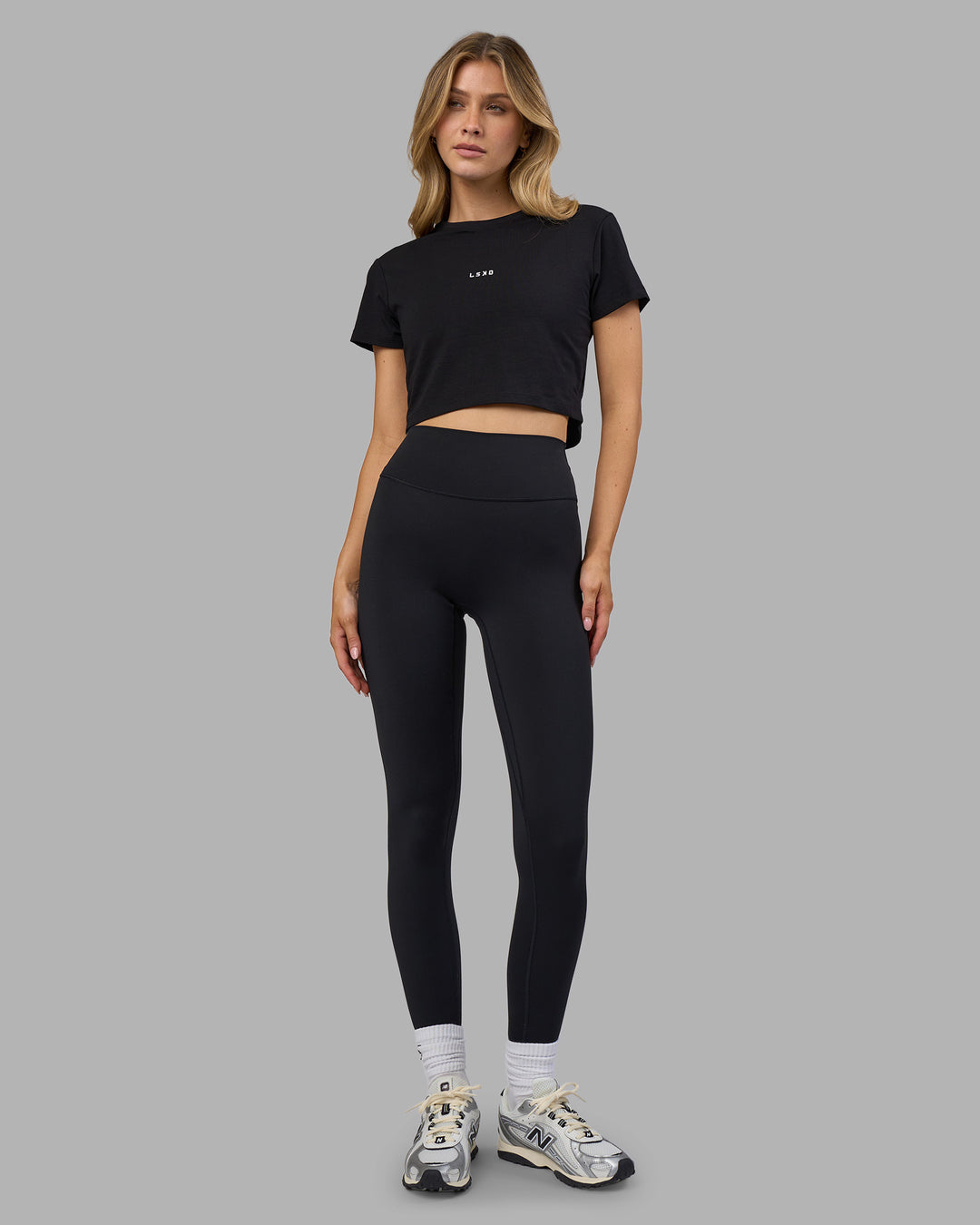 Woman wearing Go-To FLXCotton Baby Tee - Black-White | Model:Leilani | Size:XS