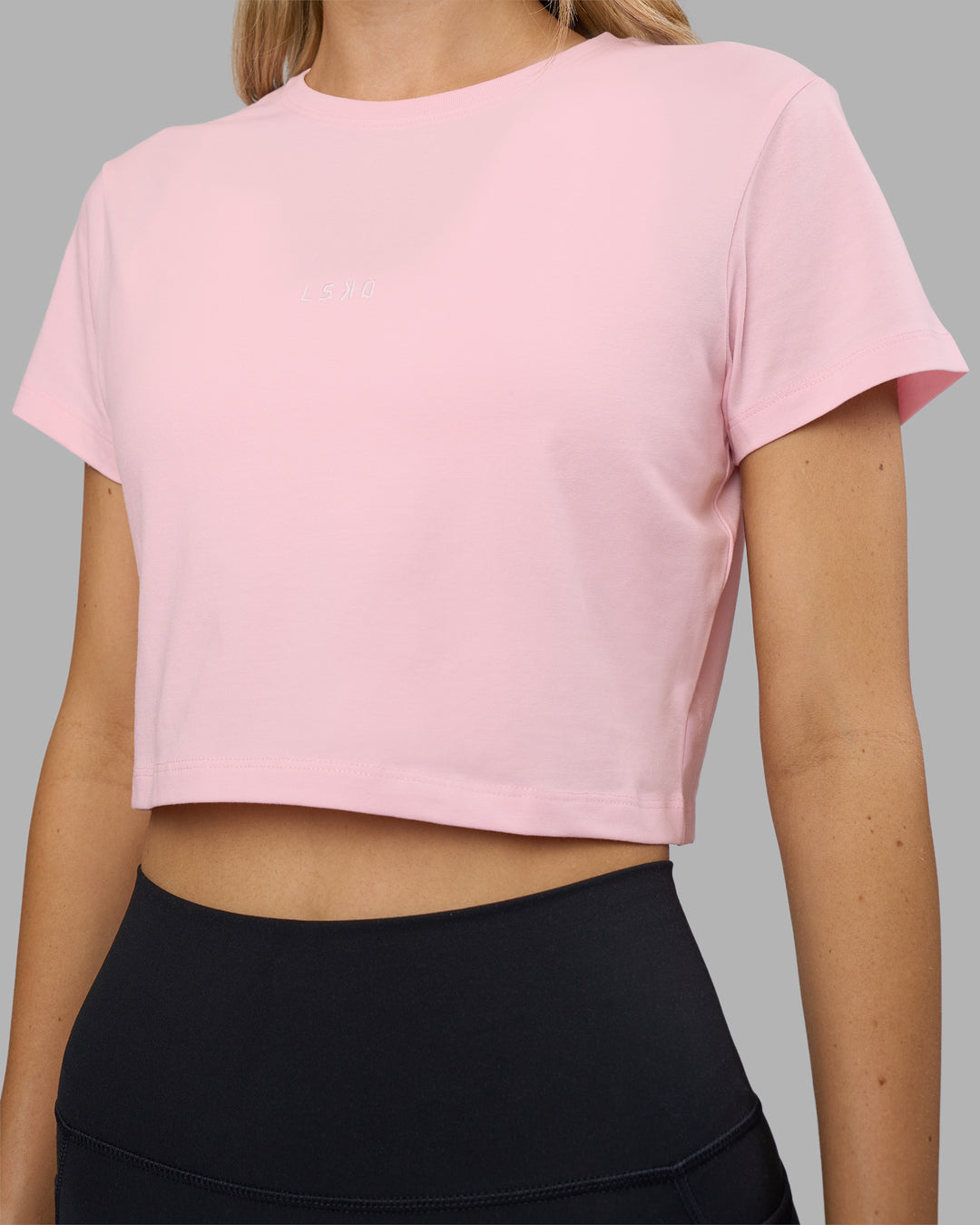 Woman wearing Go-To FLXCotton Baby Tee - Marshmallow-White | Model:Leilani | Size:XS