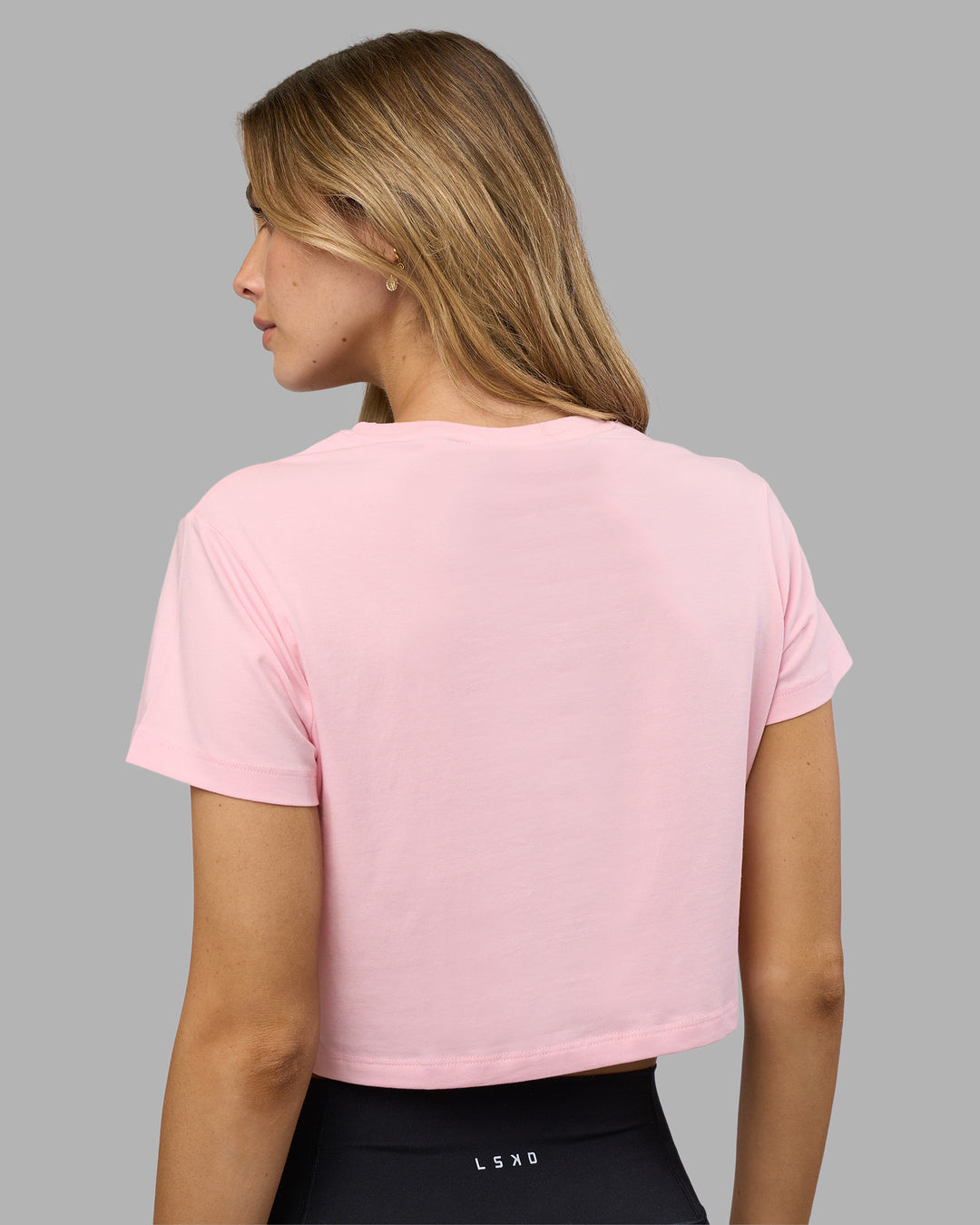 Woman wearing Go-To FLXCotton Baby Tee - Marshmallow-White | Model:Leilani | Size:XS