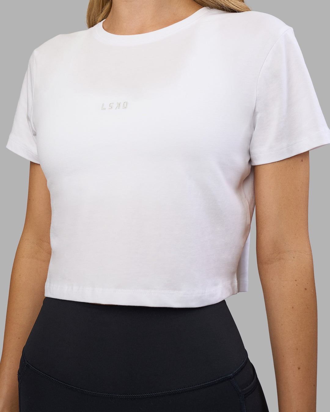 Woman wearing Go-To FLXCotton Baby Tee - White-Digital Mist | Model:Leilani | Size:XS