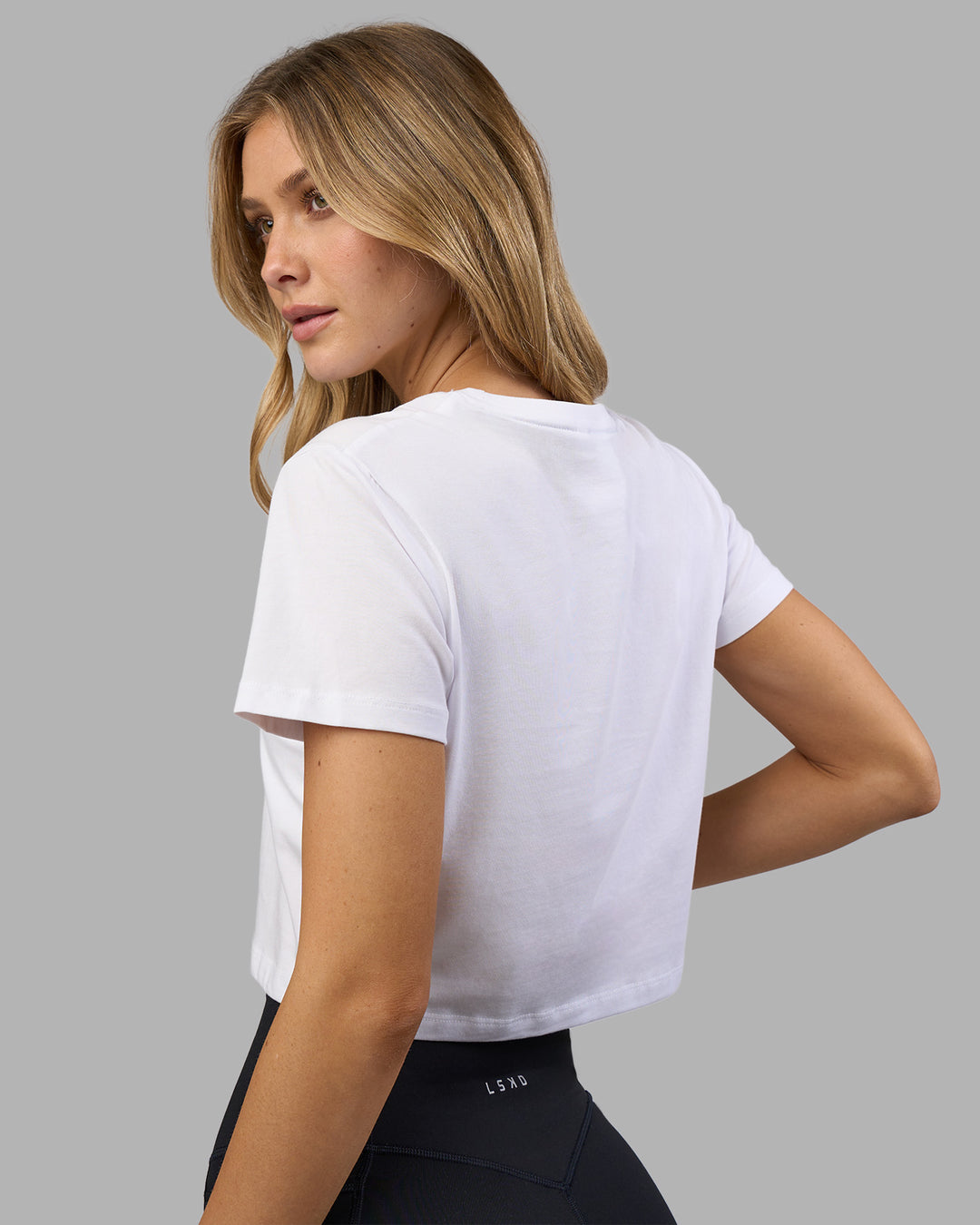 Woman wearing Go-To FLXCotton Baby Tee - White-Digital Mist | Model:Leilani | Size:XS