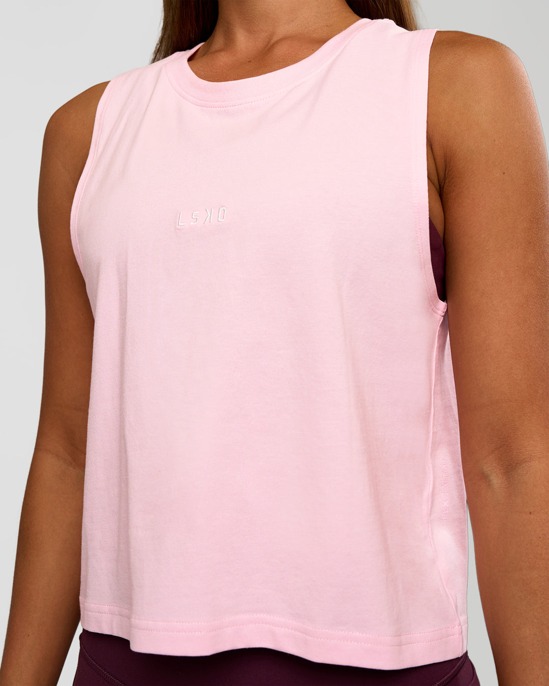 Woman wearing Go-To FLXCotton Midline Tank - Marshmallow-White | Model:Brylee | Size:XS