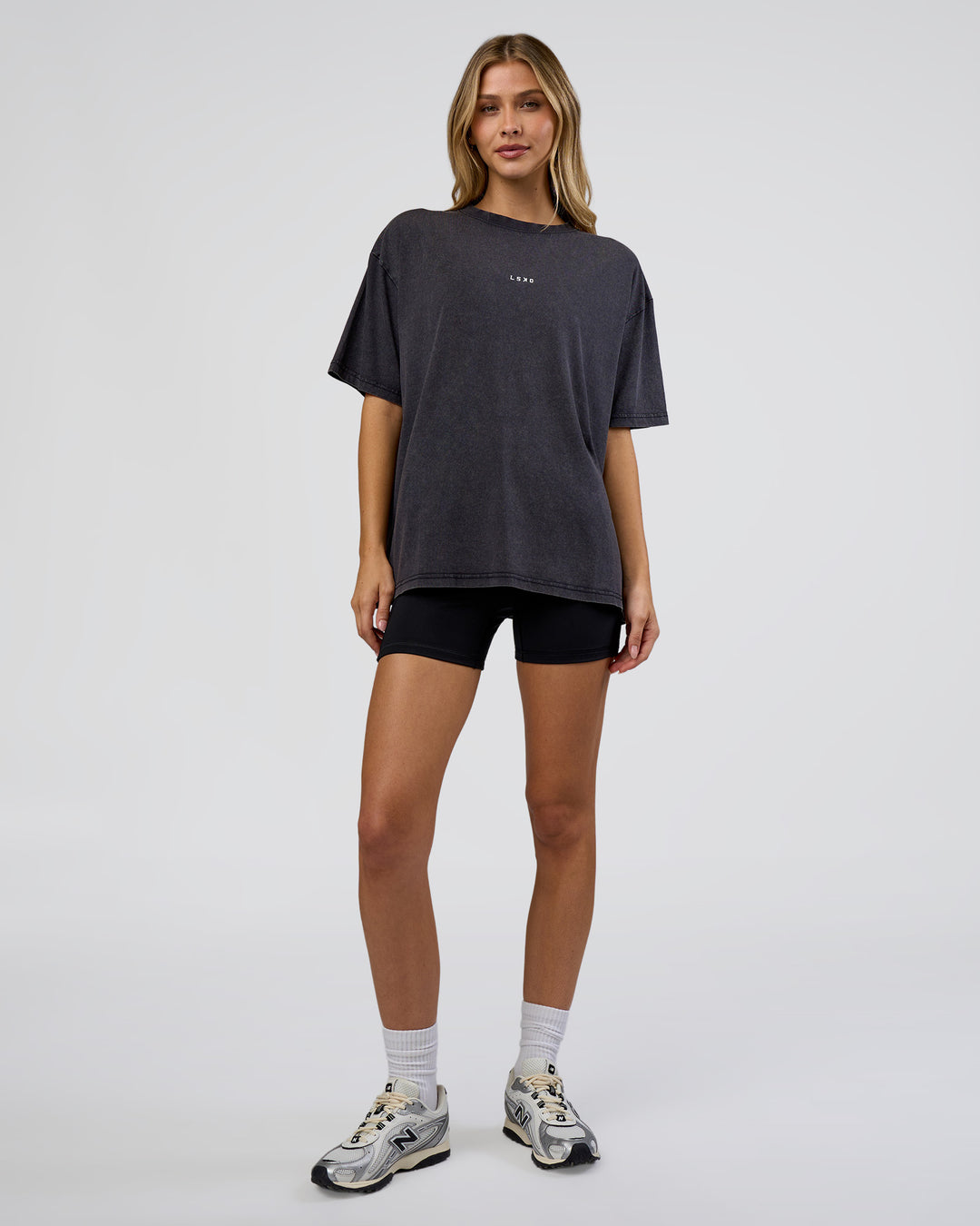 Woman wearing Go-To FLXCotton Oversized Tee - Black Washed-White | Model:Leilani | Size:S